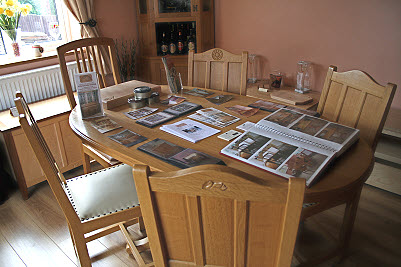 oval oak table and a selection of dining chairs