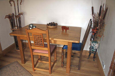 rectangular table and dining chairs with carving